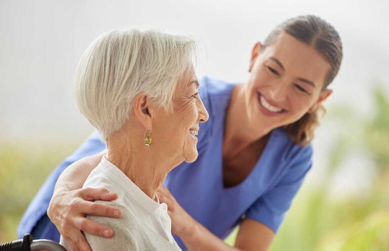 A senior resident choosing food from a colorful buffet line in a communal dining room.